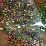 Christmas tree decorated with purple ornaments