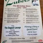 The back of the menu shares the Bill Zuber Story.