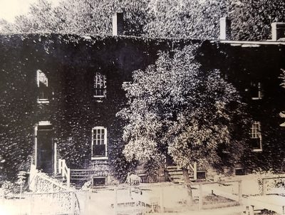 old photo of Zubers with ivy on walls