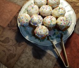 cupcakes with icing and sprinkles on top