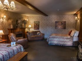 #3 The Whitetail room with bed, recliner, sofa, fireplace