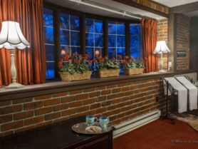 #6 The Red Carpet Room with flowers on window sill and lamps