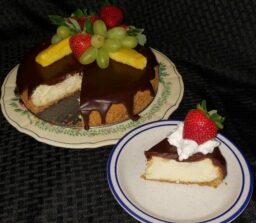 chocolate covered cheese cake with slice cut out