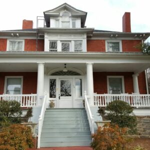 front of Chestnut Street house, red with white banisters
