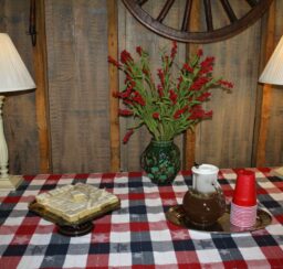 table with cake and beverage with cups