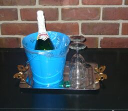 champagne in blue bucket and glasses