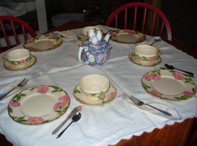 tea set with pink flowers, blue teapot