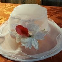 White hat with red flower