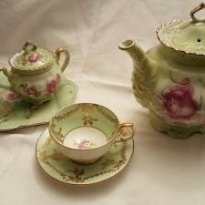 green teaset with pink flowers