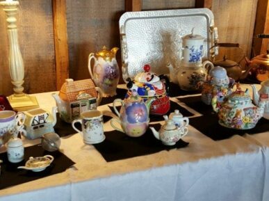 various teapots on table