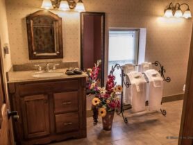 Walnut Grove bathroom with sink and white towels