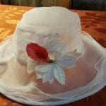white hat with red flower